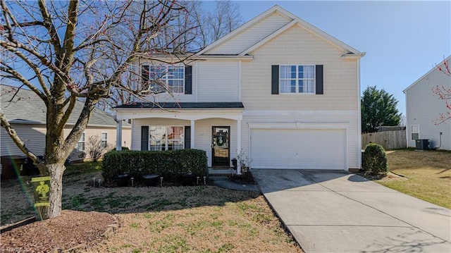 view of front facade with fence, a porch, concrete driveway, central AC unit, and a garage