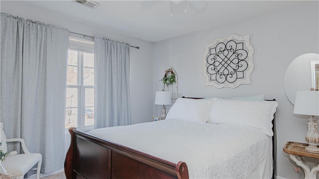 bedroom with visible vents and a ceiling fan