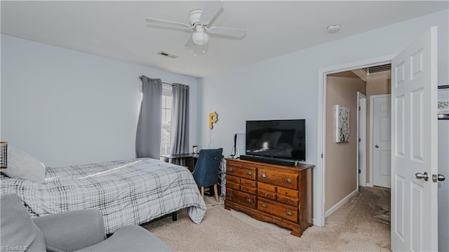 carpeted bedroom with a ceiling fan, baseboards, and visible vents