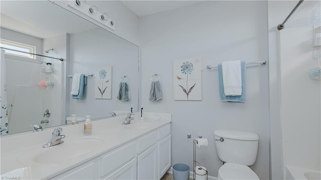 full bathroom with double vanity, toilet, shower / tub combo with curtain, and a sink