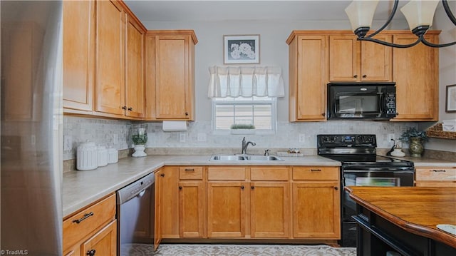 kitchen with decorative backsplash, black appliances, light countertops, and a sink