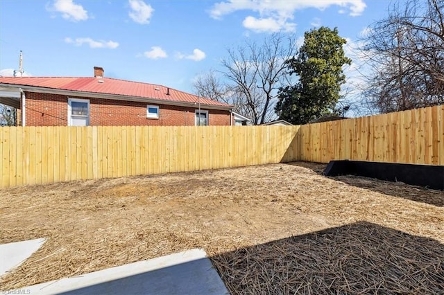 view of yard featuring a fenced backyard