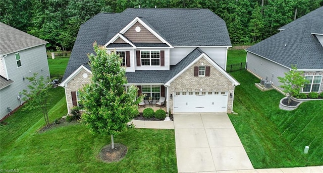 1117 Magenta Way, Kernersville, NC 27284 - view of front of property with driveway, roof with shingles, brick siding, and central AC