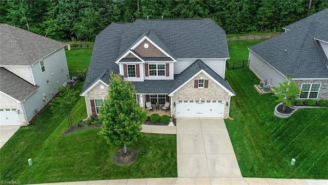 1117 Magenta Way, Kernersville, NC 27284 - view of front of house featuring concrete driveway, a garage, and roof with shingles