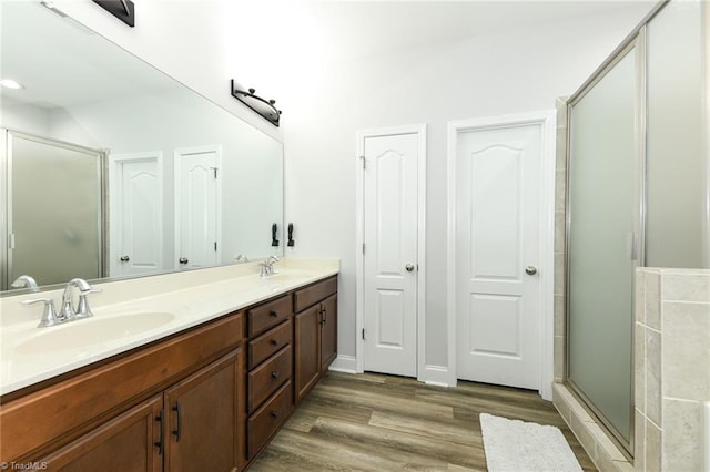 1117 Magenta Way, Kernersville, NC 27284 - bathroom featuring wood finished floors, double vanity, and a stall shower