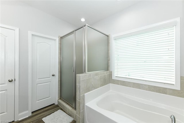 1117 Magenta Way, Kernersville, NC 27284 - bathroom featuring a bath, a shower stall, and wood finished floors