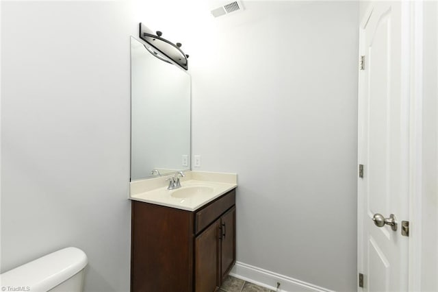 1117 Magenta Way, Kernersville, NC 27284 - bathroom with vanity, toilet, baseboards, and tile patterned flooring