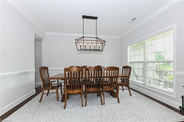 1117 Magenta Way, Kernersville, NC 27284 - dining area with wood finished floors, ornamental molding, baseboards, and a chandelier
