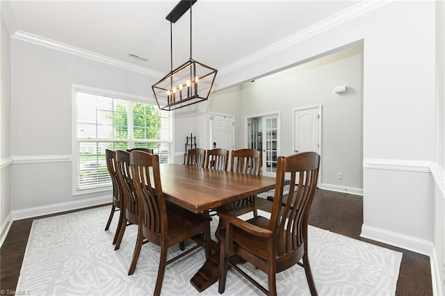 1117 Magenta Way, Kernersville, NC 27284 - dining area featuring ornamental molding, baseboards, wood finished floors, a chandelier, and french doors