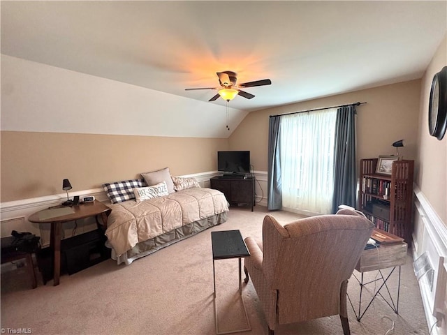 carpeted bedroom featuring ceiling fan and lofted ceiling