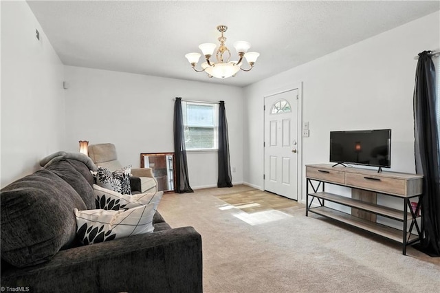 827 Woodcote Dr, Winston-Salem, NC 27107 - living room featuring a chandelier and carpet floors