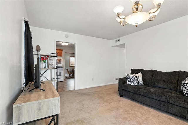 827 Woodcote Dr, Winston-Salem, NC 27107 - living area featuring light colored carpet and a chandelier