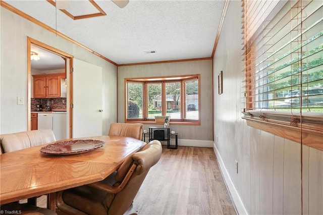 827 Woodcote Dr, Winston-Salem, NC 27107 - dining area featuring ornamental molding, light wood finished floors, and a textured ceiling