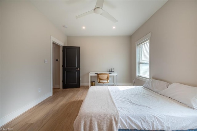 unfurnished bedroom featuring recessed lighting, a ceiling fan, light wood-type flooring, and baseboards