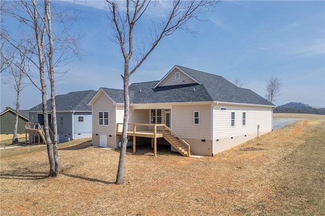 back of house featuring crawl space, stairway, a wooden deck, and a shingled roof