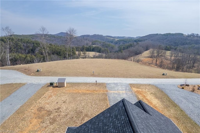 exterior space featuring a wooded view