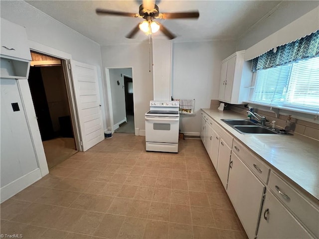 kitchen with white range with electric cooktop, a sink, a ceiling fan, white cabinets, and crown molding