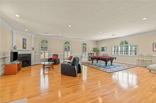 rec room featuring recessed lighting, pool table, ornamental molding, and light wood-style floors