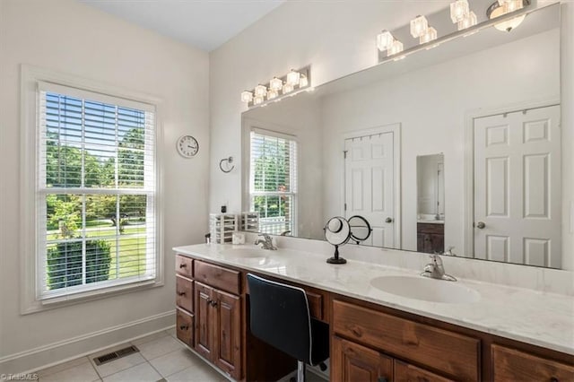 2515 E Woodlyn Way, Greensboro, NC 27407 - full bath with tile patterned flooring, double vanity, and baseboards