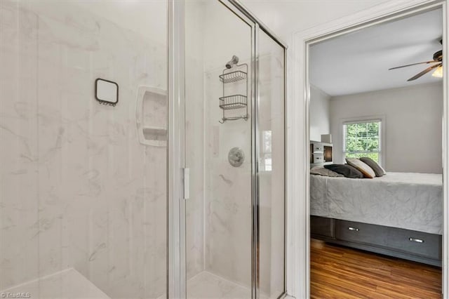 2515 E Woodlyn Way, Greensboro, NC 27407 - ensuite bathroom featuring a marble finish shower, a ceiling fan, and wood finished floors