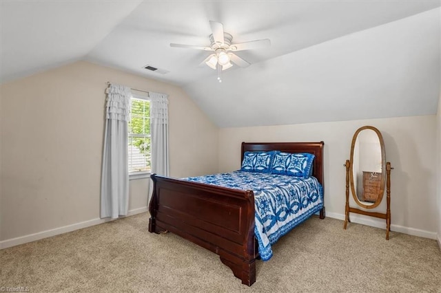 2515 E Woodlyn Way, Greensboro, NC 27407 - carpeted bedroom with vaulted ceiling, baseboards, and a ceiling fan