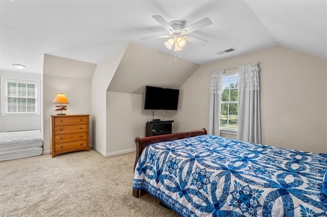 2515 E Woodlyn Way, Greensboro, NC 27407 - bedroom with lofted ceiling, carpet floors, ceiling fan, and baseboards