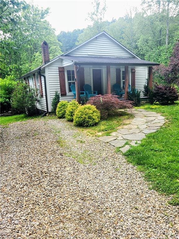 3273 N NC Highway 16, Millers Creek, NC 28651 - rear view of property with a chimney and a porch