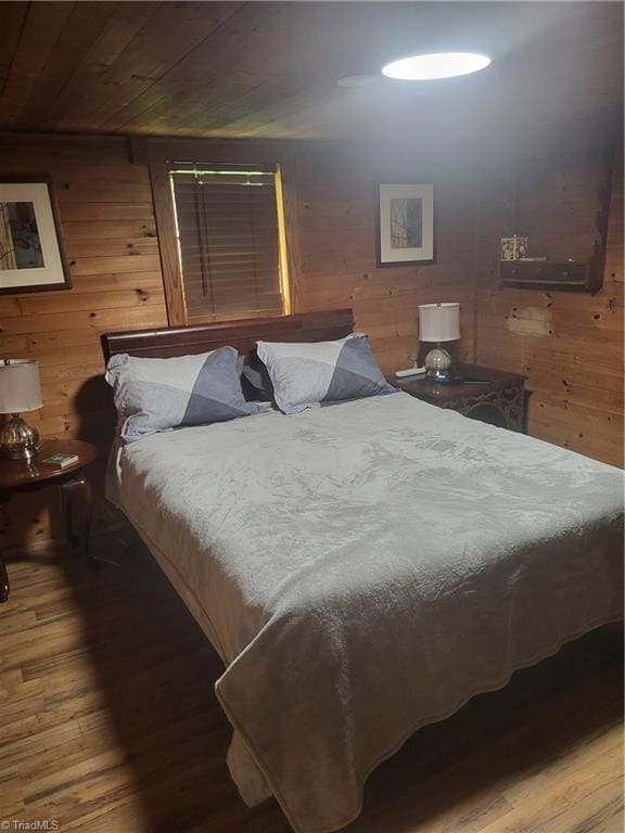 3273 N NC Highway 16, Millers Creek, NC 28651 - bedroom featuring hardwood / wood-style flooring, wood walls, and wooden ceiling