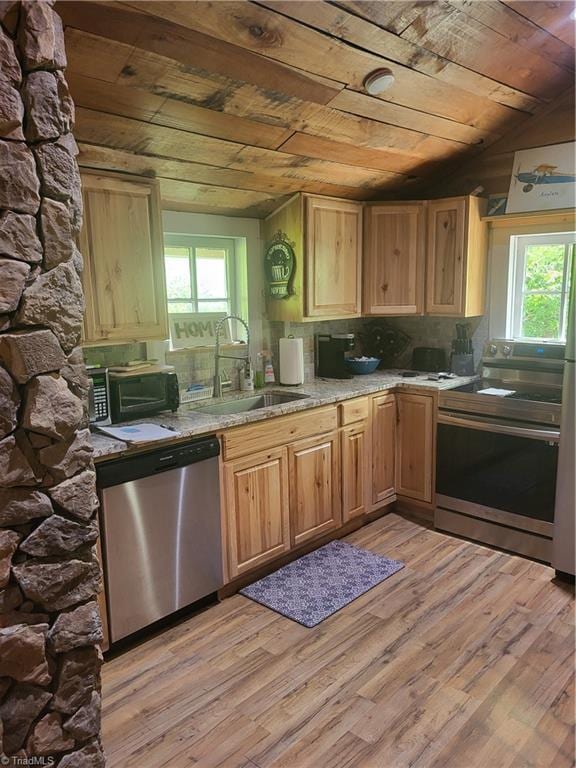 3273 N NC Highway 16, Millers Creek, NC 28651 - kitchen with appliances with stainless steel finishes, wood ceiling, light wood-type flooring, backsplash, and vaulted ceiling