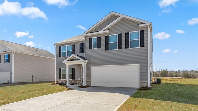 144 Rose Wind Way, Mayodan, NC 27027 - view of front of home with an attached garage, a front lawn, central AC, and concrete driveway