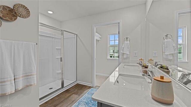144 Rose Wind Way, Mayodan, NC 27027 - full bathroom with a shower stall, wood finished floors, and a sink