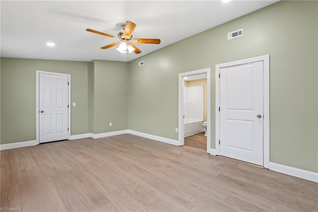 empty room featuring ceiling fan and light hardwood / wood-style floors