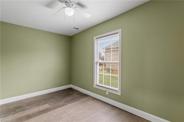 spare room with ceiling fan and light hardwood / wood-style floors