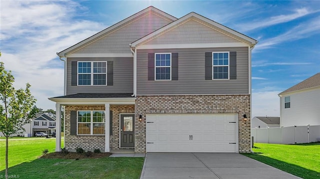 craftsman house with a garage, fence, a front lawn, and concrete driveway