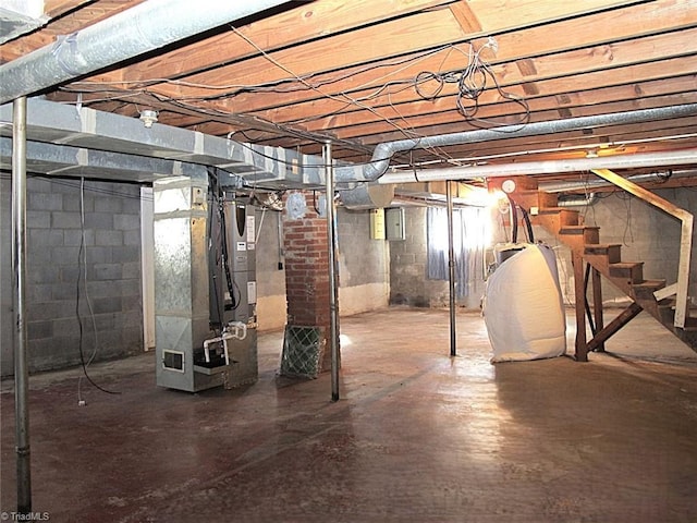 basement with heating unit and electric panel