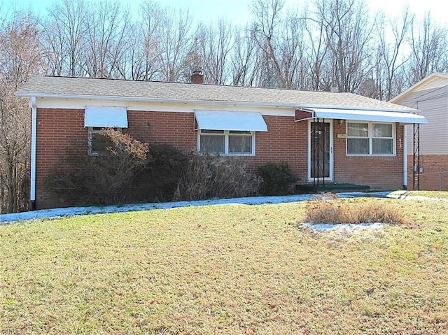 ranch-style house with a front lawn