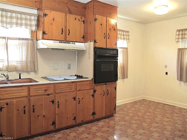 kitchen featuring sink and black appliances