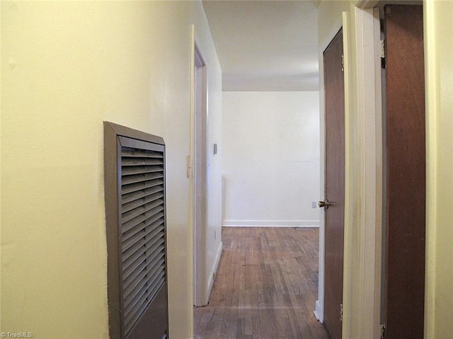 corridor featuring hardwood / wood-style floors