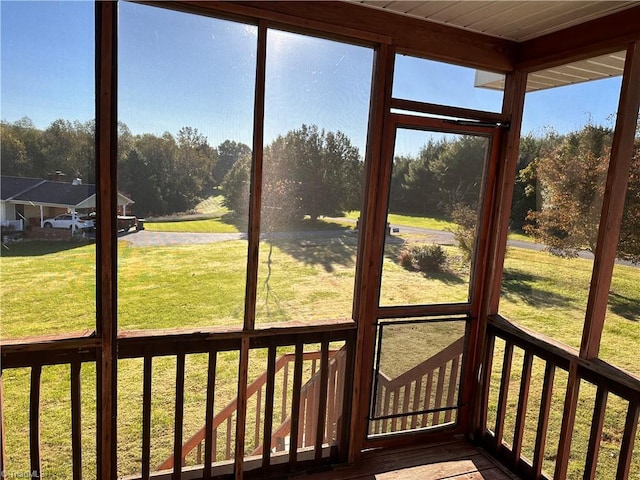 unfurnished sunroom with beamed ceiling and wooden ceiling