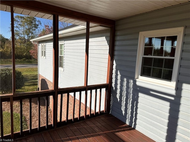 unfurnished sunroom with wooden ceiling