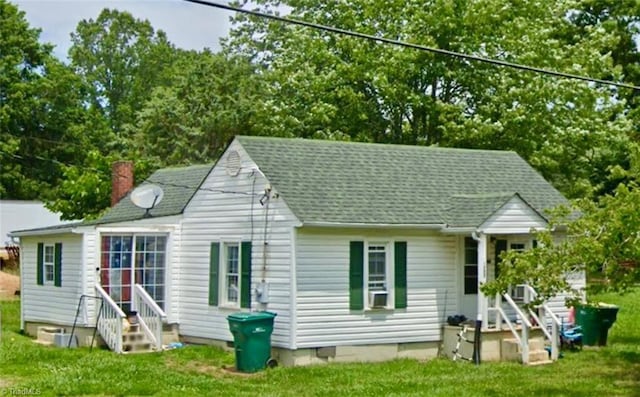 back of house with a yard