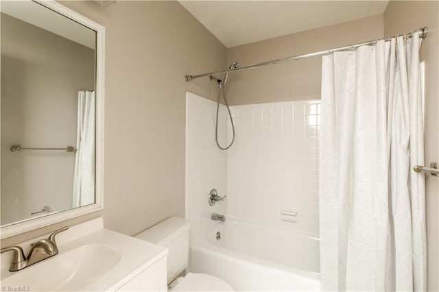 full bathroom with vanity, toilet, and shower / tub combo