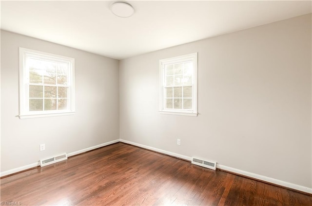 empty room featuring hardwood / wood-style flooring