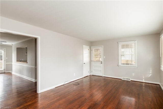 unfurnished room with dark hardwood / wood-style floors