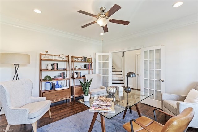 sitting room featuring ceiling fan, wood-type flooring, ornamental molding, and french doors