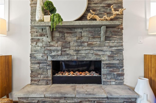 room details featuring a stone fireplace