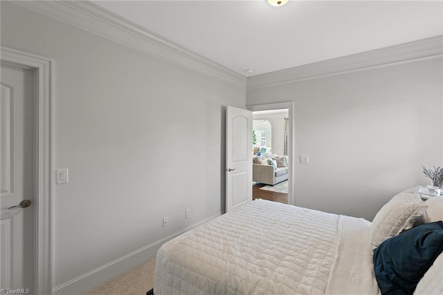 bedroom with carpet flooring and ornamental molding