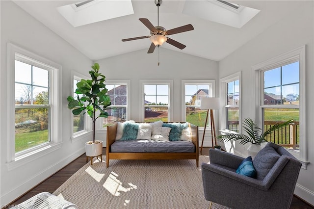 sunroom / solarium with ceiling fan, plenty of natural light, and lofted ceiling with skylight