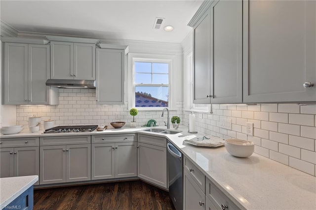 kitchen with tasteful backsplash, gray cabinetry, sink, and stainless steel appliances