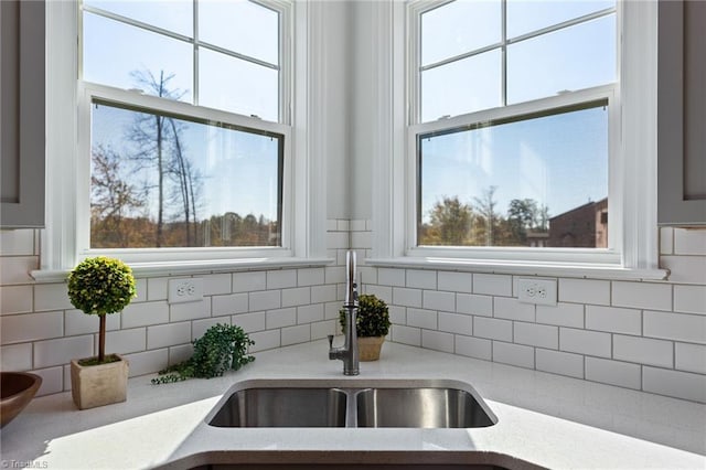 room details with decorative backsplash and sink